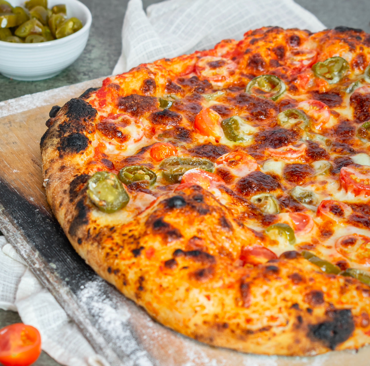 Cherry tomato and jalapeño pizza