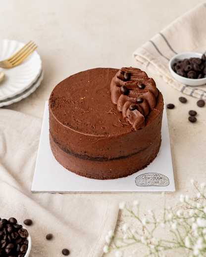 Classic chocolate cake in bright natural light