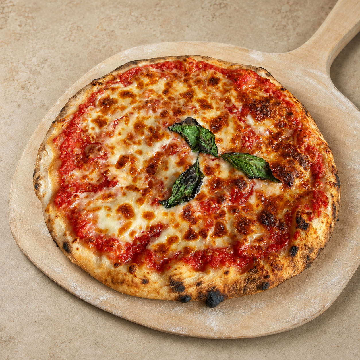 Margherita sourdough pizza on a wooden pizza peel