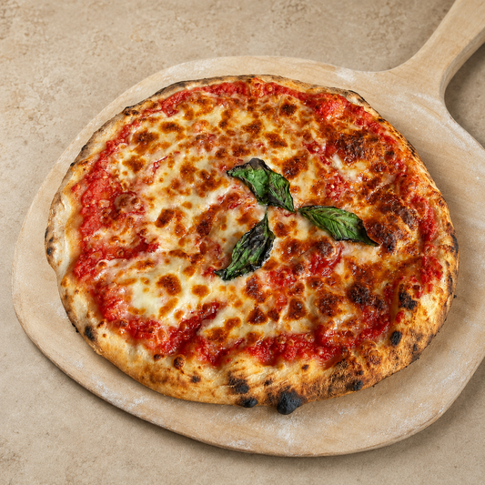 Margherita sourdough pizza on a wooden pizza peel