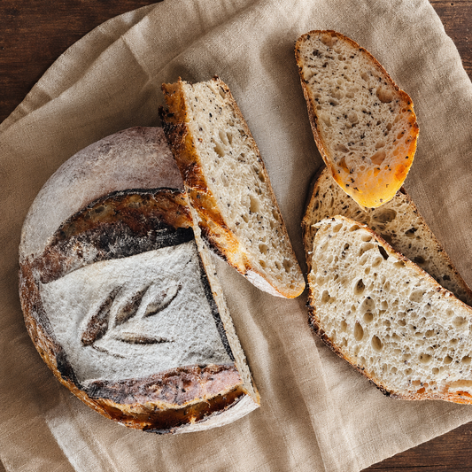 Quinoa and whole grain sourdough loaf with sliced crumb